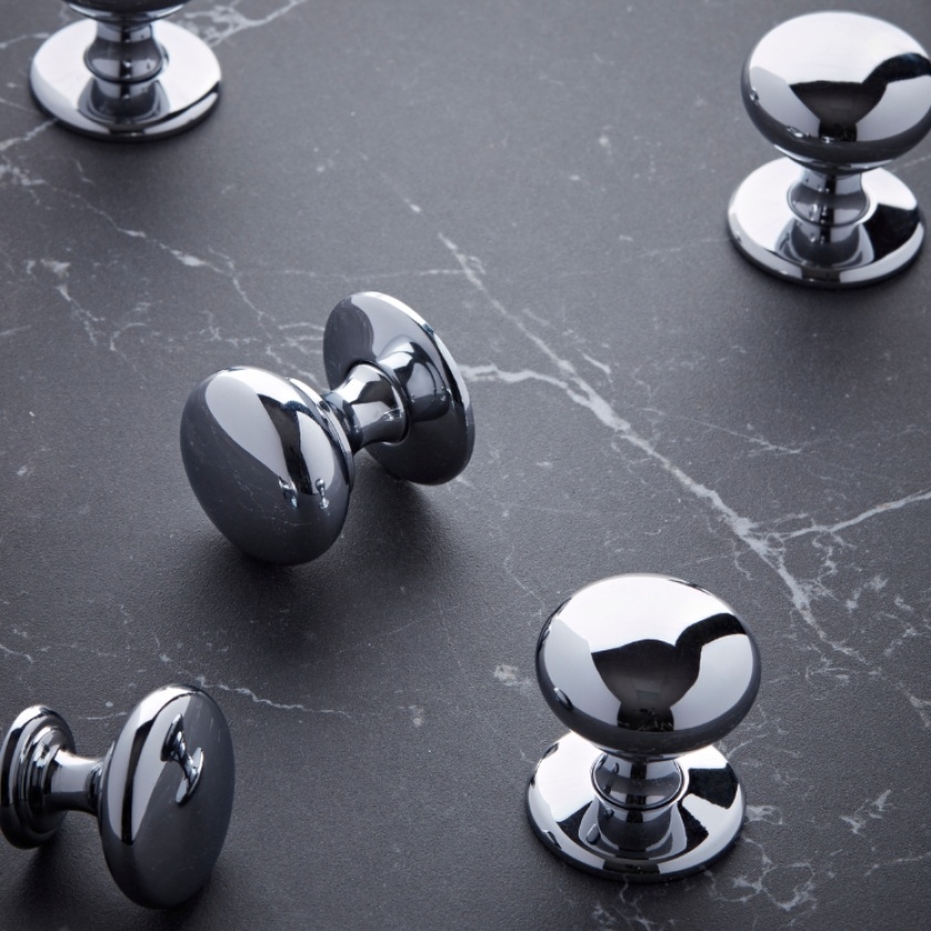 Close up product image of five Roper Rhodes Chrome Knobs with Backplates